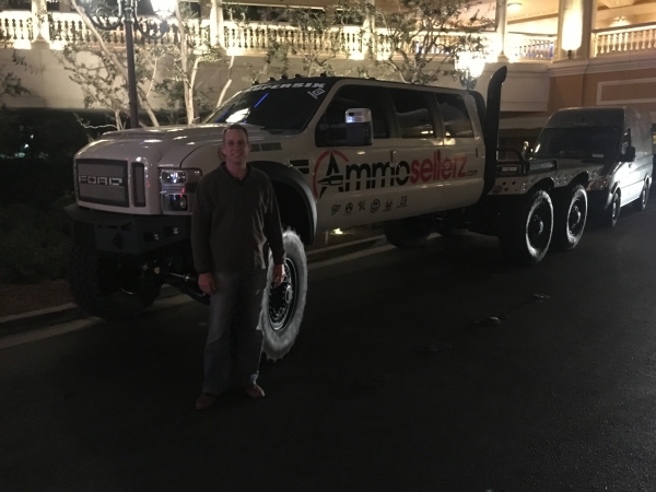 Jack standing in front of a big work vehicle in Las Vegas.